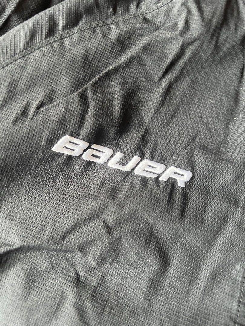 Bauer Waterloo Wolves Hockey Track Jacket (Category: Coats, Jackets and Outerwear) located in Borongan. Submitted by thriftsbyblas (Listing ID 1460932536, Image 3). Description: - Black Bauer track jacket - Features embroidered Waterloo Wolves logo - White piping detail along the sides - Full zip front with Bauer branded zipper pull - Size: M/M - Perfect for any fan!.