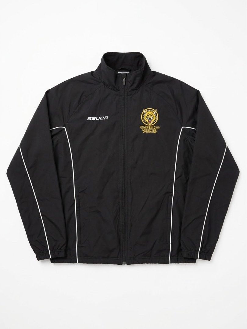 Bauer Waterloo Wolves Hockey Track Jacket (Category: Coats, Jackets and Outerwear) located in Borongan. Submitted by thriftsbyblas (Listing ID 1460932536, Image 1). Description: - Black Bauer track jacket - Features embroidered Waterloo Wolves logo - White piping detail along the sides - Full zip front with Bauer branded zipper pull - Size: M/M - Perfect for any fan!.