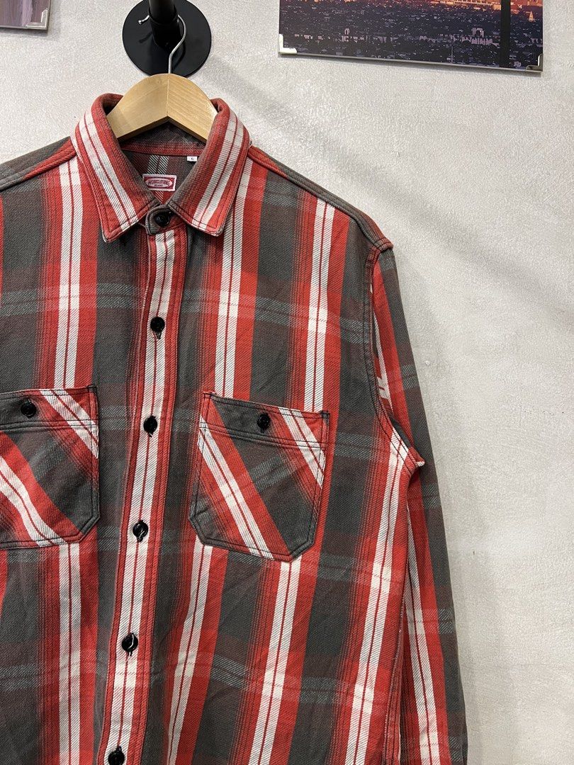 Beams Work Clothing Beams Casual Button down shirt (Category: Tshirts & Polo Shirts ) located in Manila. Submitted by -handpick- (Listing ID 1461020924, Image 3). Description: The featured item is a vintage-style plaid flannel work shirt from the Japanese label Beams. Known for its high-quality construction and classic Americana-inspired aesthetics, this piece showcases a rugged check pattern in red, charcoal grey, and white, complete with distin