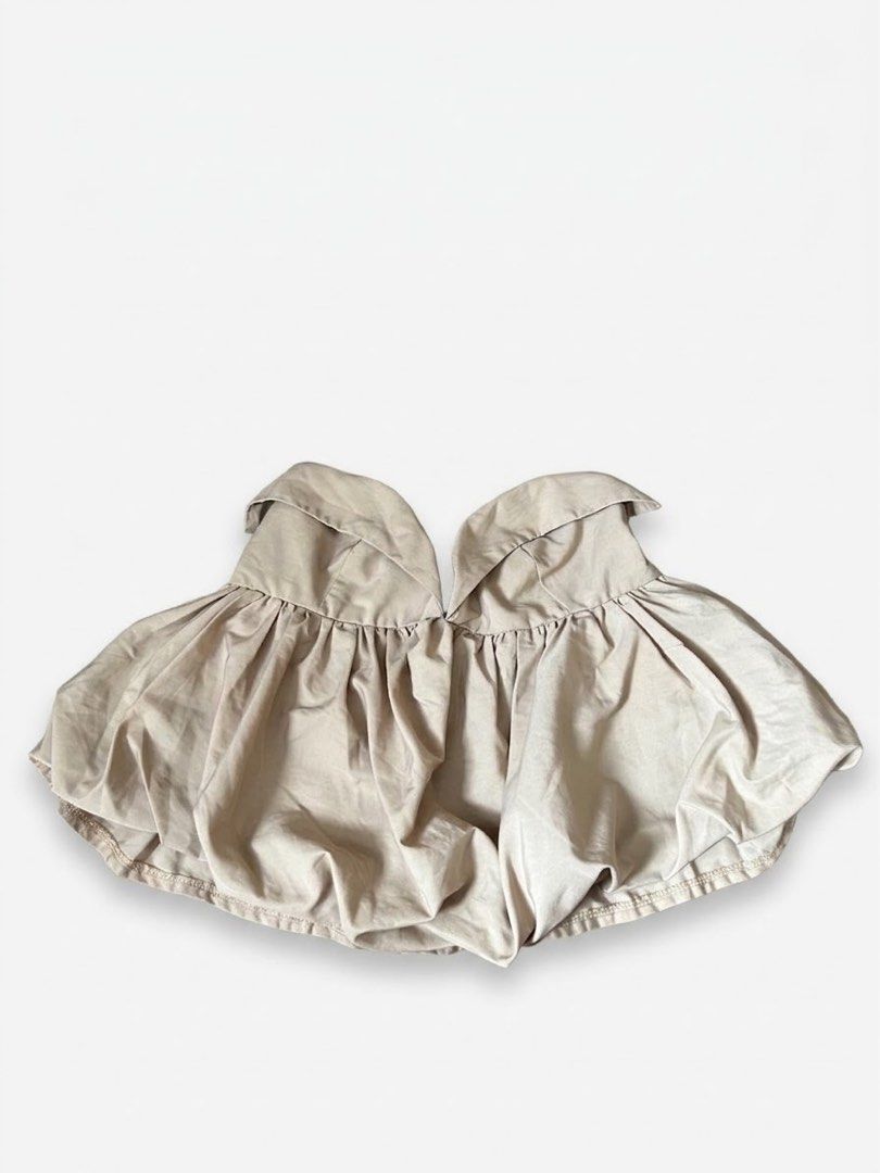 Beige Strapless Bubble Top (Category: Sleeveless) located in Makati City. Submitted by secondseries (Listing ID 1460928947, Image 2). Description: - could fit small to medium - that’s the actual top po - Cute beige strapless top - Features a gathered bust - Stylish bubble hem - Flowy and airy fabric - Versatile for casual or night out looks - Pairs well with jeans or skirts - Easy to style.