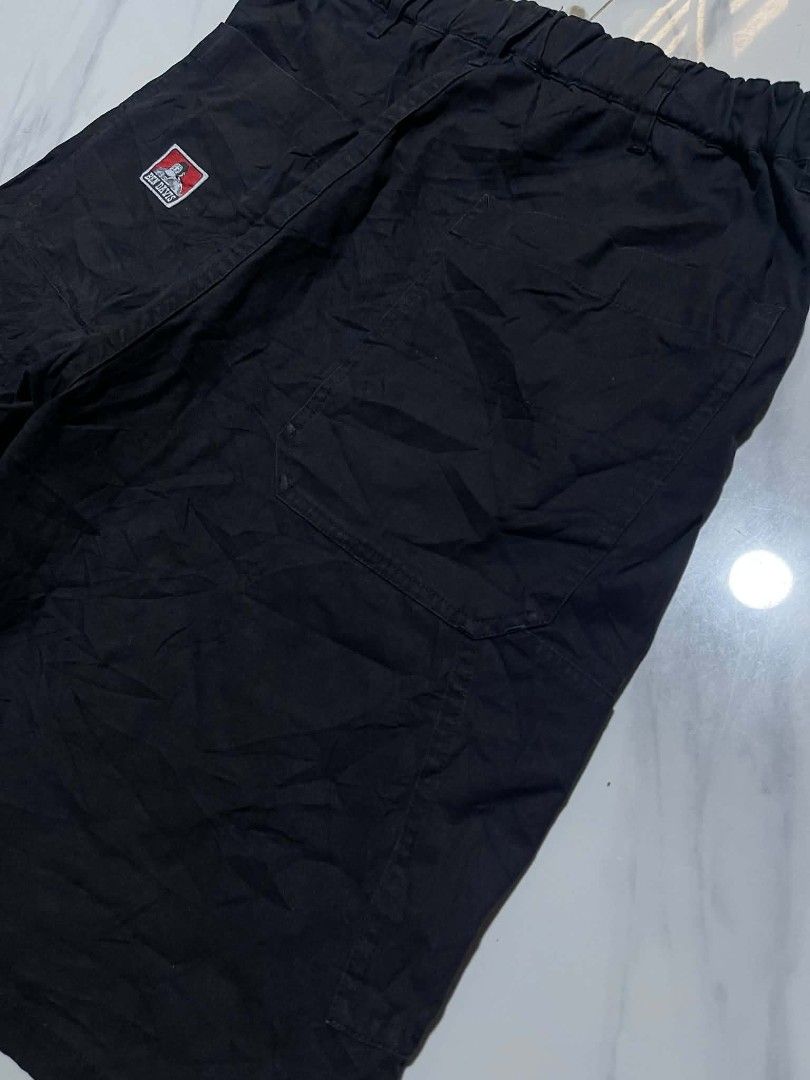 Ben Davis Black Cargo Shorts Size M (Category: Shorts) located in Pangantucan. Submitted by calmwhale_cb83a8 (Listing ID 1460947315, Image 2). Description: - Black Ben Davis - Size: Medium (M-L) - issue above zip one female button lock need repair or replace - Features an elastic waistband with a drawstring for adjustable comfort - Convenient side and back pockets for essentials - Unique inner lining with an all-over Ben Davis print - Ideal for c