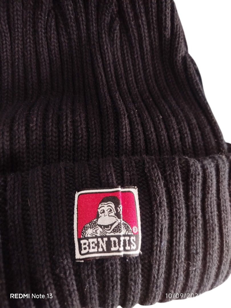 Ben Davis Black Ribbed Beanie Hat (Category: Caps & Hats) located in Leyte. Submitted by jpsrvd19 (Listing ID 1461064198, Image 2). Description: - Classic black ribbed beanie - Features iconic Ben Davis red and white logo patch - Made from comfortable material for warmth - Simple and stylish design - Perfect for everyday wear.