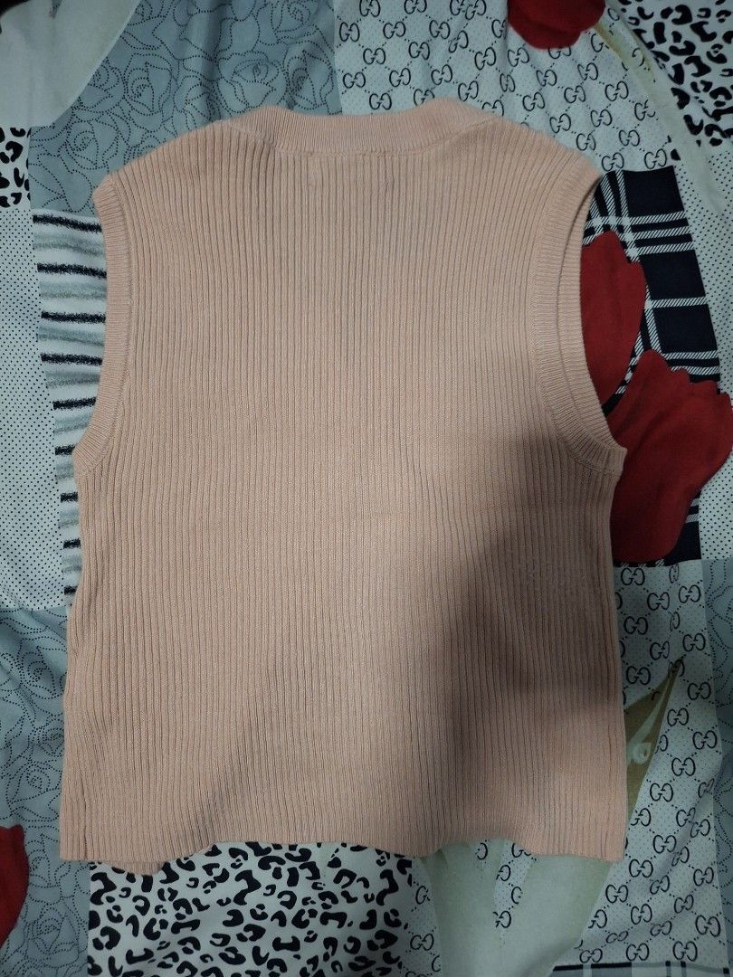 BENCH Pink Ribbed Button-Up Vest Top (Category: Sleeveless) located in Plaridel. Submitted by niannyyy (Listing ID 1461037437, Image 3). Description: - Pink ribbed cardigan from BENCH - Short sleeves - Button-up front - Stretchy and comfortable material - Worn Once - Versatile for casual or dressy occasions.