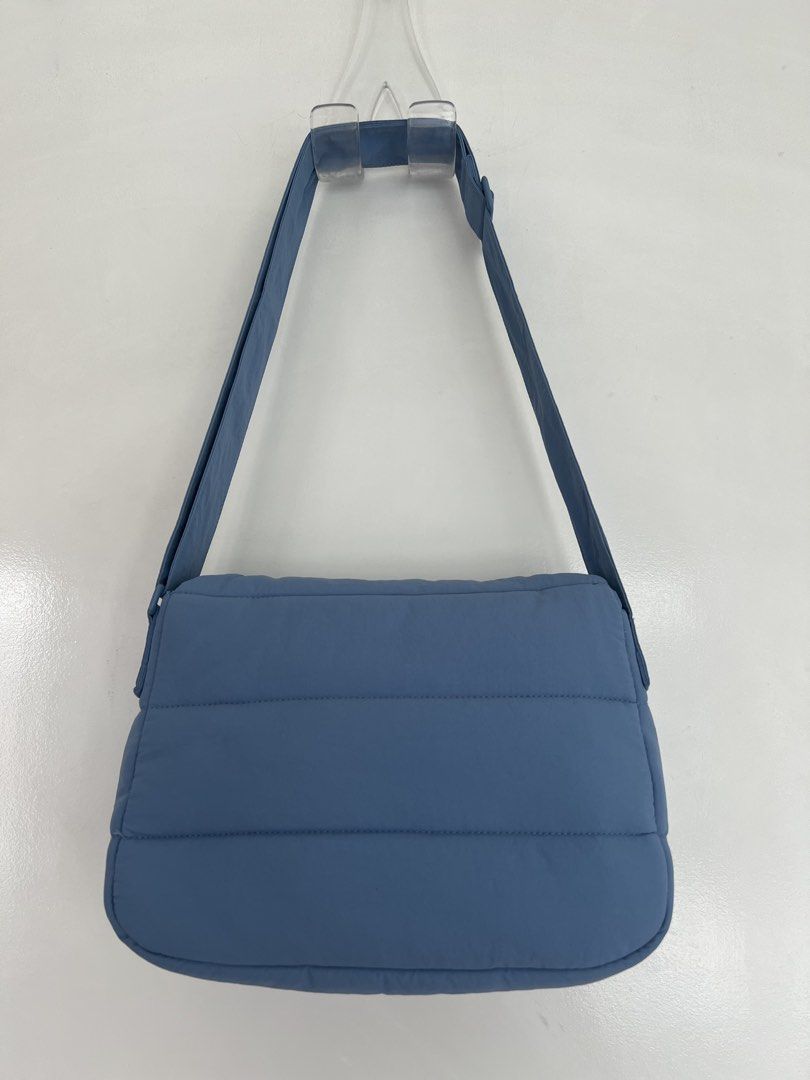 Beyond the Vibes Poofy Bag (Periwinkle) (Category: Shoulder Bags) located in Makati City. Submitted by hereasysupply (Listing ID 1460963354, Image 2). Description: *removable pouch not included anymore Made from water resistant nylon, this Poofy Bag can be carried on the shoulder or as a cross body bag by adjusting the straps, making it a versatile piece for casual days or formal evenings. Designed with a front flap with a magnetic closure, this 