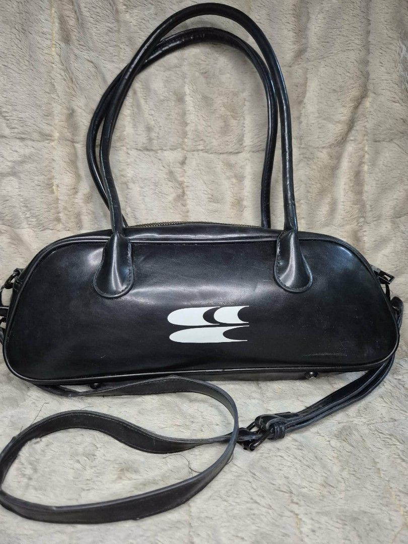 Black Barrel Bag with White Logo (Category: Luxury Bags & Wallets) located in Manila. Submitted by mysticfox.9b1678 (Listing ID 1461071443, Image 1). Description: - Stylish black barrel-style handbag - Features a prominent white logo on the front - Comes with comfortable top handles - Includes a detachable shoulder strap for versatile carrying - Secure zipper closure to keep your belongings safe - Made from durable faux leather material - Ideal f