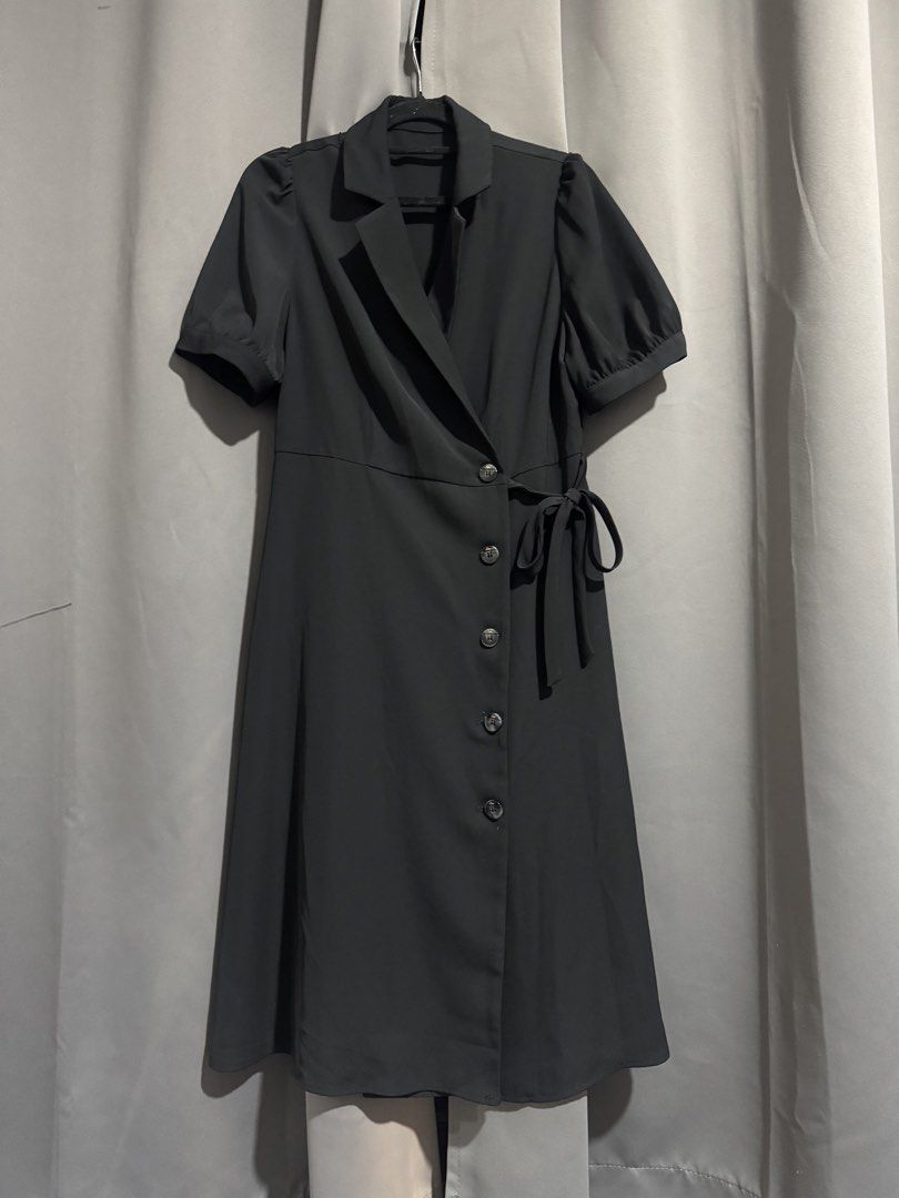 Black Blazer Wrap Dress with Puff Sleeves (Category: Dresses) located in Manila. Submitted by ainanicole82544 (Listing ID 1461104713, Image 1). Description: - Elegant black wrap dress - Features a sharp blazer-style collar - Short, stylish puff sleeves - Adjustable tie waist for a flattering fit - Functional button details down the front - Versatile for both office wear and night outs - Creates a polished and put-together look.