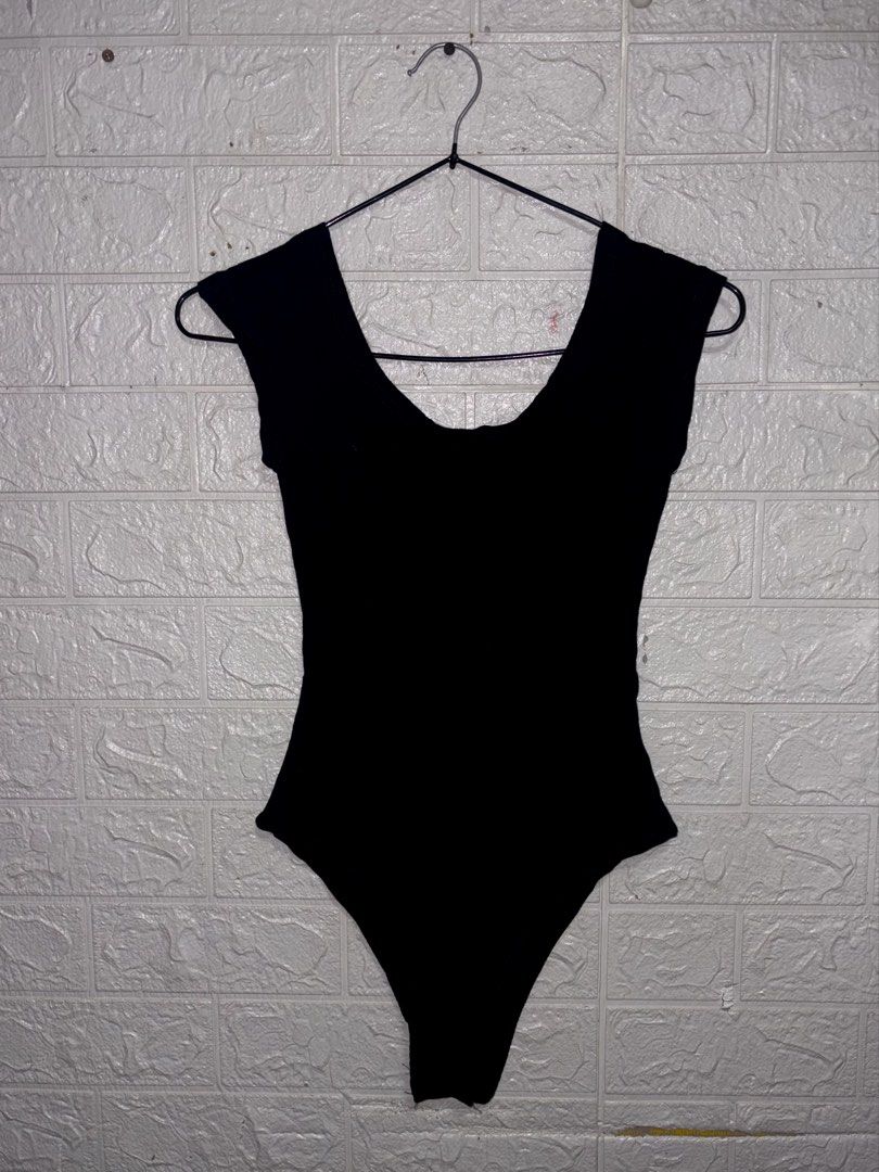 Black Cap Sleeve Scoop Neck Bodysuit (Category: Others Tops) located in Manila. Submitted by _noname.shop (Listing ID 1461054512, Image 1). Description: - Basic black bodysuit - Cap sleeves - Scoop neckline (front) - Open back design - Stretchy material - Versatile for layering or wearing on its own.