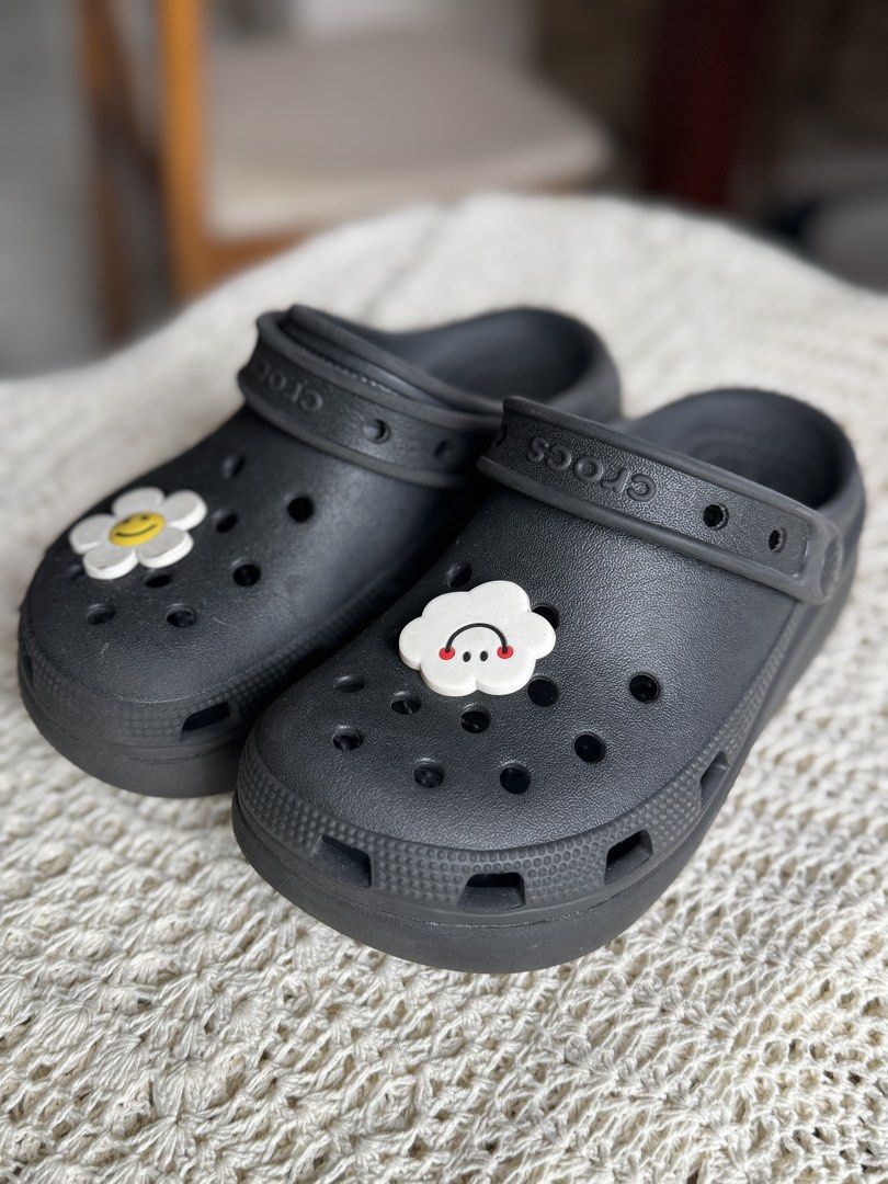 Black Crocs with Flower and Cloud Charms (Category: Babies & Kids Fashion) located in Bacolod City. Submitted by vintage_vogue6100 (Listing ID 1461038662, Image 2). Description: - J1 /EU 32-33 - Classic black Crocs - Includes cute flower and cloud Jibbitz charms - Easy slip-on design - Ideal for casual wear - Features visible Crocs logo on strap and heel - Offers iconic Crocs comfort.
