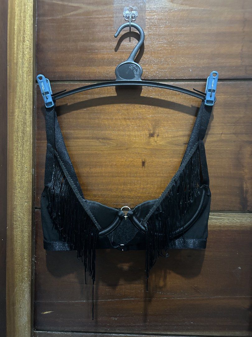 Black Fringe Bra by Olivia Chase (Category: Activewear) located in Quezon City. Submitted by enojasrena81355 (Listing ID 1461037903, Image 2). Description: - Brand: Olivia Chase - Color: Black - Size: S - Features: Fringe detailing, adjustable straps, front clasp closure - Style: Great for layering or as a statement piece - Adds flair to any outfit.