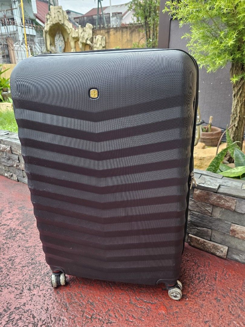 Black Hardshell Spinner Luggage Large Size 17 x 26 inch (Category: Luggage) located in Bulacan. Submitted by rafaesarisari (Listing ID 1461056328, Image 2). Description: - Black hardshell spinner luggage - Textured exterior with horizontal stripe design - Built-in TSA lock for security - Four spinner wheels for effortless maneuverability - Ideal for all your travels - Note: Minor scuffs on wheels due to normal use note : naka stock lang po kaya f