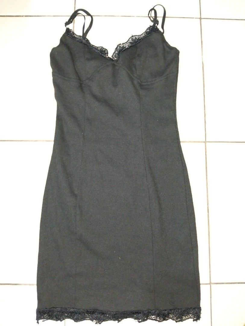 Black Lace Trim Mini Dress (Category: Dresses) located in Manila. Submitted by oddhorse_8ada97 (Listing ID 1460979347, Image 2). Description: - Sleek black mini dress - Elegant lace trim on neckline and hem - Delicate spaghetti straps - Textured ribbed fabric - Flattering fitted silhouette - Ideal for layering or wearing solo.