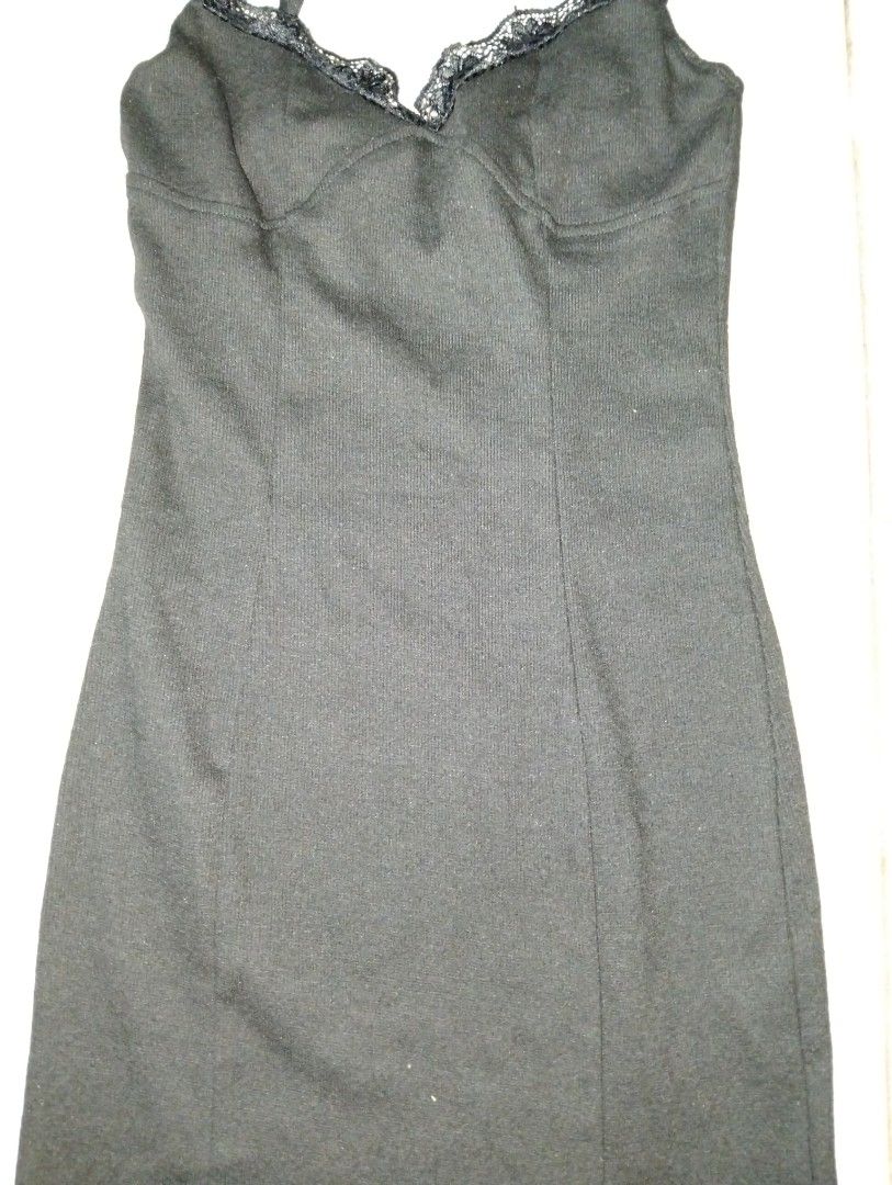 Black Lace Trim Mini Dress (Category: Dresses) located in Manila. Submitted by oddhorse_8ada97 (Listing ID 1460979347, Image 3). Description: - Sleek black mini dress - Elegant lace trim on neckline and hem - Delicate spaghetti straps - Textured ribbed fabric - Flattering fitted silhouette - Ideal for layering or wearing solo.