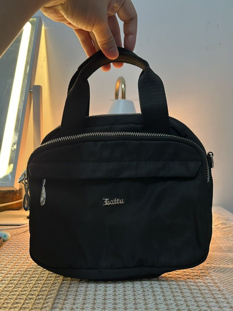 Black Laitu Nylon Shoulder Bag (Category: Luxury Bags & Wallets) located in San Pablo. Submitted by anicahclosetonlineshop (Listing ID 1460942080, Image 3). Description: mini bag nylon material with sling many zipper compartments Laitu brand like new condition payment first via gcash or bank transfer.