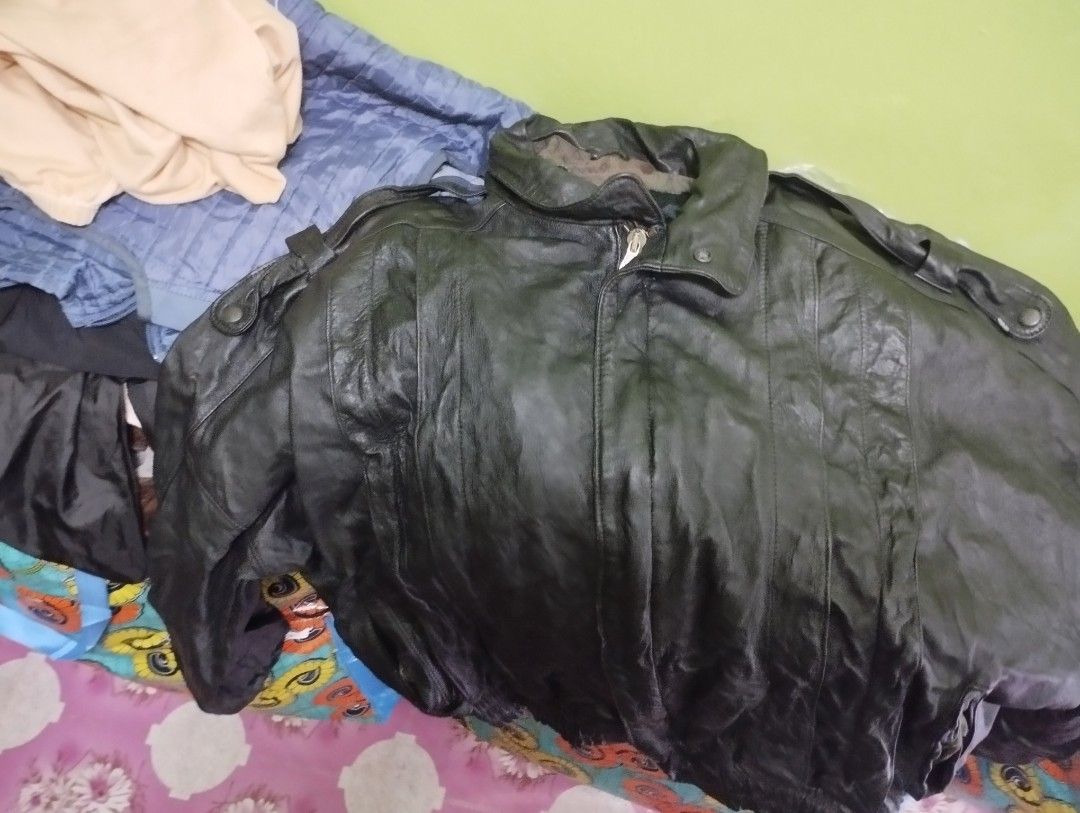 Black Leather Jacket with Collar Boxy Fit (Category: Coats, Jackets and Outerwear) located in Cabuyao City. Submitted by odddolphin-aa30 (Listing ID 1461043065, Image 1). Description: - Classic black leather jacket - Sturdy zipper closure - Buttoned collar - Stylish shoulder epaulets - Ideal for cooler weather - Shows typical leather creasing for its age - 24-25 x 24-25 .