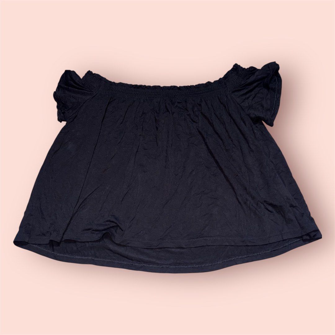 Black Off-the-Shoulder Smocked Top (Category: Blouses) located in Rosario. Submitted by preloveditems2002 (Listing ID 1461045716, Image 1). Description: - Black off-the-shoulder top - Smocked neckline for a secure and stylish fit - Flutter sleeves add a feminine touch - Made from flowy, comfortable fabric - Versatile: great for casual days or nights out - Easy to style with jeans or shorts.