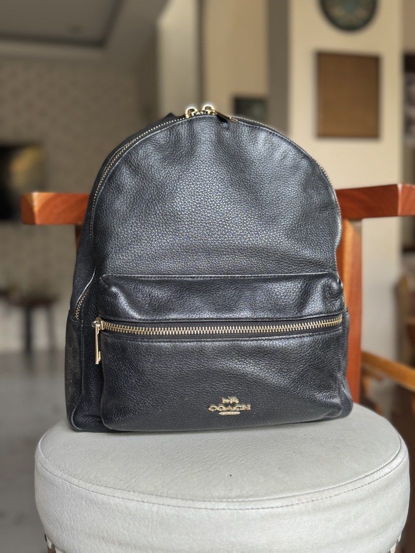 Black Pebbled Leather Backpack Gold Hardware (Category: Backpacks) located in Bacolod City. Submitted by vintage_vogue6100 (Listing ID 1461072441, Image 1). Description: - Material: Black pebbled leather - Hardware: Gold zippers and accents - Pockets: Front zip pocket, main zip compartment - Style: Classic, versatile - Ideal for: Everyday use, travel.