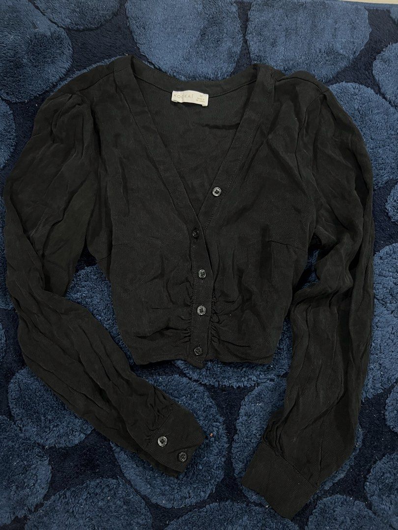 Black Ribbed Cropped Cardigan with Ruched Front (Category: Coats, Jackets and Outerwear) located in Abucay. Submitted by pmuffy24 (Listing ID 1461099656, Image 1). Description: - Cute black cropped cardigan - Ribbed texture - Ruched detail down the front - Full button-up closure - Long sleeves with button cuffs - Versatile: pairs well with high-waisted pants or skirts.