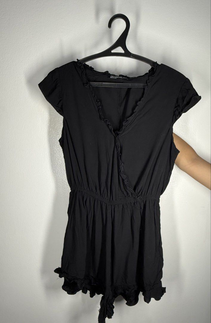 Black Ruffle V-Neck Romper (Category: Rompers) located in Angeles City. Submitted by lesmiz24601 (Listing ID 1460968426, Image 1). Description: - Adorable black romper with charming ruffle details. - Features a comfortable elastic waistband for a perfect fit. - Short sleeves and short legs for a breezy feel. - Versatile for casual day trips or a stylish night out. - Effortlessly pairs with sandals or heels for different looks..
