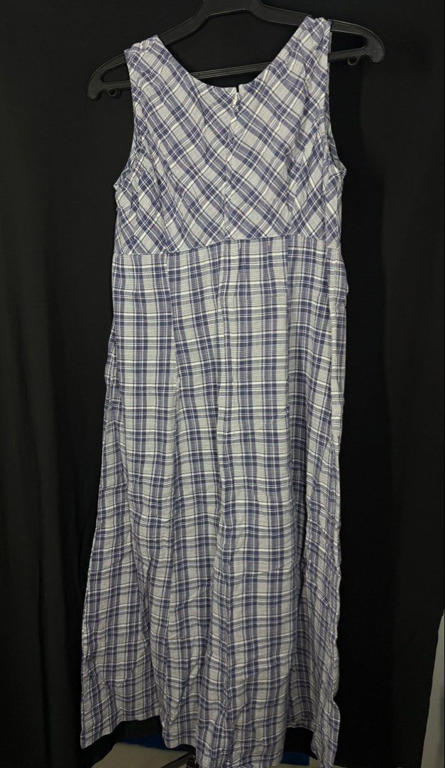 Blue and White Plaid Maxi Dress (Category: Dresses) located in Angeles City. Submitted by lesmiz24601 (Listing ID 1460965673, Image 1). Description: - Blue and white plaid maxi dress - Sleeveless with V-neckline - Empire waist with gathered skirt - Back zipper closure - Comfortable and breezy fabric - Ideal for casual outings and relaxed days.