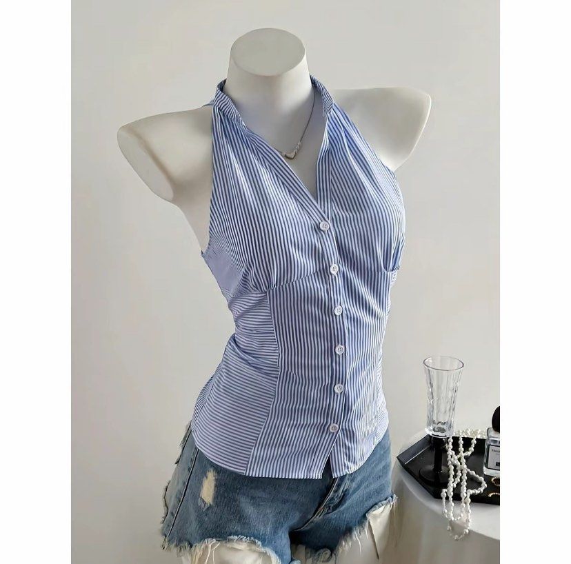 Blue and White Striped Halter Neck Button-Up Top (Category: Sleeveless) located in Manila. Submitted by jijuballcart (Listing ID 1461114717, Image 1). Description: - rfs: does not fit - Cute blue and white striped halter top - Button-up front - Fitted style - Pairs well with shorts or jeans - Ideal for casual days or nights out.