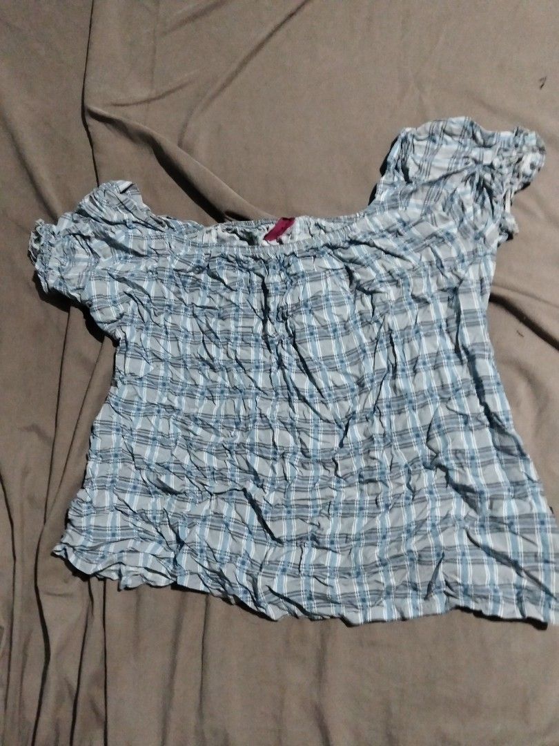 Blue Plaid Smocked Off-Shoulder Top (Category: Blouses) located in Manila. Submitted by arissamanuel31 (Listing ID 1461043757, Image 1). Description: - Adorable blue and white plaid pattern - Trendy smocked texture all over - Chic off-shoulder design - Cute short puff sleeves - Comfortable elasticated neckline - Ideal for a casual day out.