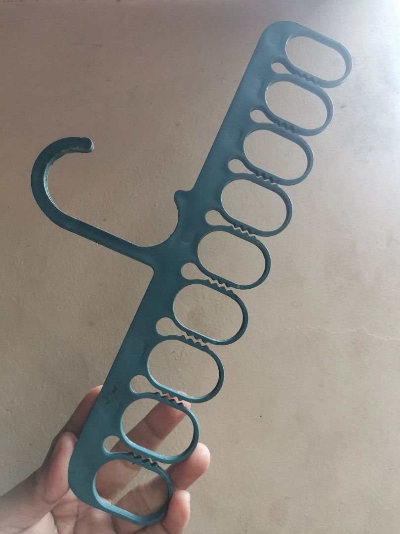 Blue Plastic Multi-Hanger for Clothes (Category: Hooks & Hangers) located in Quezon City. Submitted by c_and_a_haus (Listing ID 1460930046, Image 1). Description: - Blue plastic hanger with multiple loops - Ideal for organizing clothes and saving closet space - Hang multiple items on a single hanger - Notches on loops help prevent clothes from slipping off.