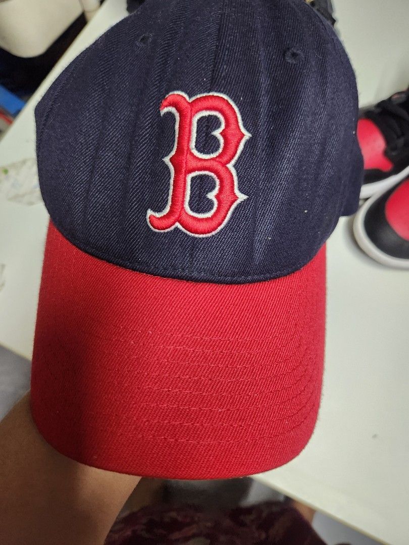 Boston Red Sox MLB Baseball Cap (Category: Caps & Hats) located in Quezon City. Submitted by amber___18 (Listing ID 1460986025, Image 1). Description: - Classic Boston Red Sox cap - Navy blue with red brim - Embroidered 'B' logo on the front - MLB logo on the side - Comfortable fit for game days or casual wear - Show your team pride!.