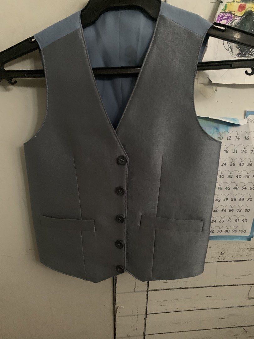 Boys Blue Suit Jacket and Vest Set (Category: Babies & Kids Fashion) located in Cavite. Submitted by sjcat (Listing ID 1460947539, Image 2). Description: - Two-piece suit set for boys - Includes blue suit jacket and grey vest - Jacket features one-button closure and two front pockets - Vest has button-up front and two front pockets - Ideal for formal occasions and parties Ideal for 7-8 years old Used 1x custom original price 2,500.