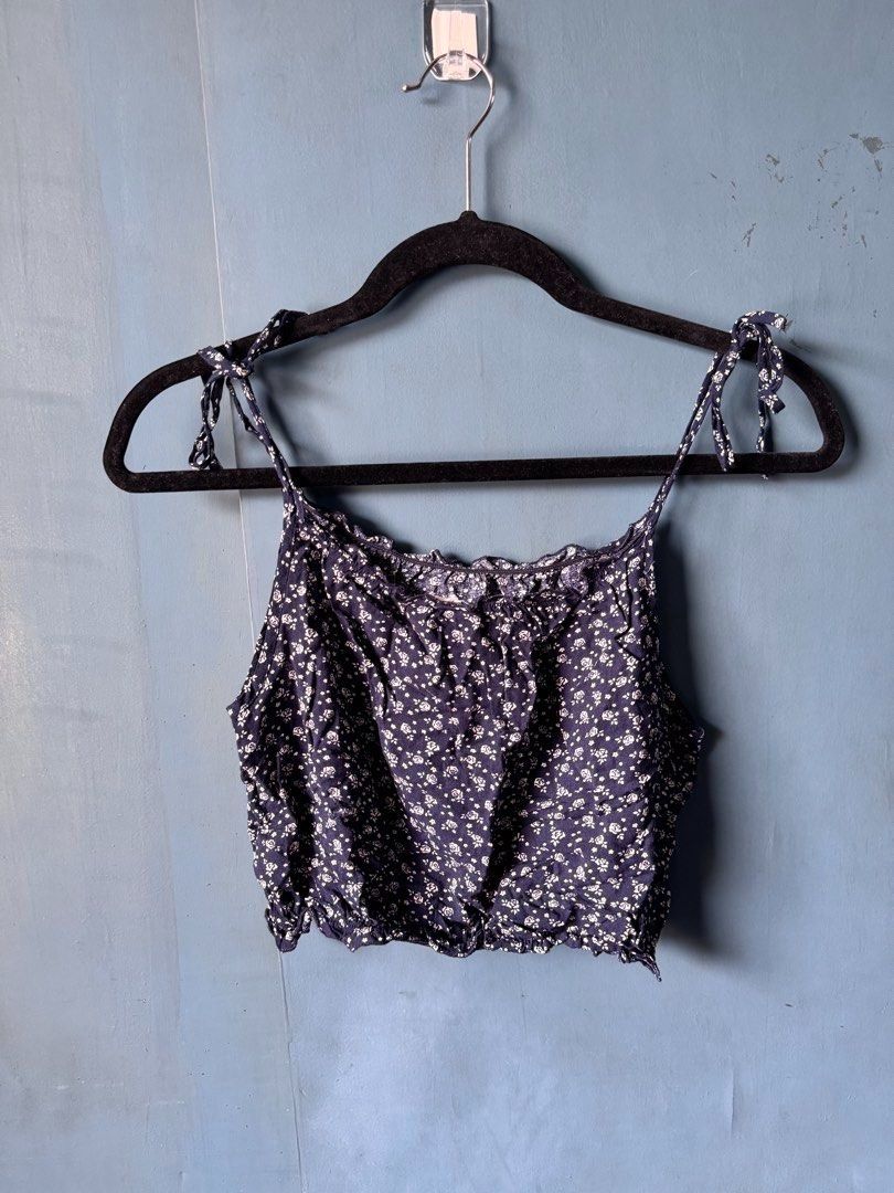 Brandy Melville Top Bundle (Category: Shirts) located in Manila. Submitted by reesespiecess (Listing ID 1461072522, Image 3). Description: Bundle of four tops. Can check my profile for the full condition of the tops! Inclusions: - Brandy Melville Black Floral Tie Front Crop Top - John Galt / J Galt Navy Floral Tie Strap Crop Top - John Galt / J Galt White Cropped T-Shirt - Brandy Melville Graphic T-Shirt - Natives of the Sun Take all four tops fo