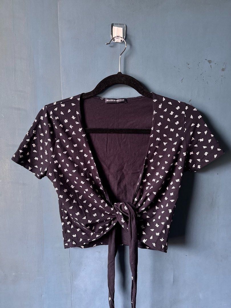 Brandy Melville Top Bundle (Category: Shirts) located in Manila. Submitted by reesespiecess (Listing ID 1461072522, Image 2). Description: Bundle of four tops. Can check my profile for the full condition of the tops! Inclusions: - Brandy Melville Black Floral Tie Front Crop Top - John Galt / J Galt Navy Floral Tie Strap Crop Top - John Galt / J Galt White Cropped T-Shirt - Brandy Melville Graphic T-Shirt - Natives of the Sun Take all four tops fo