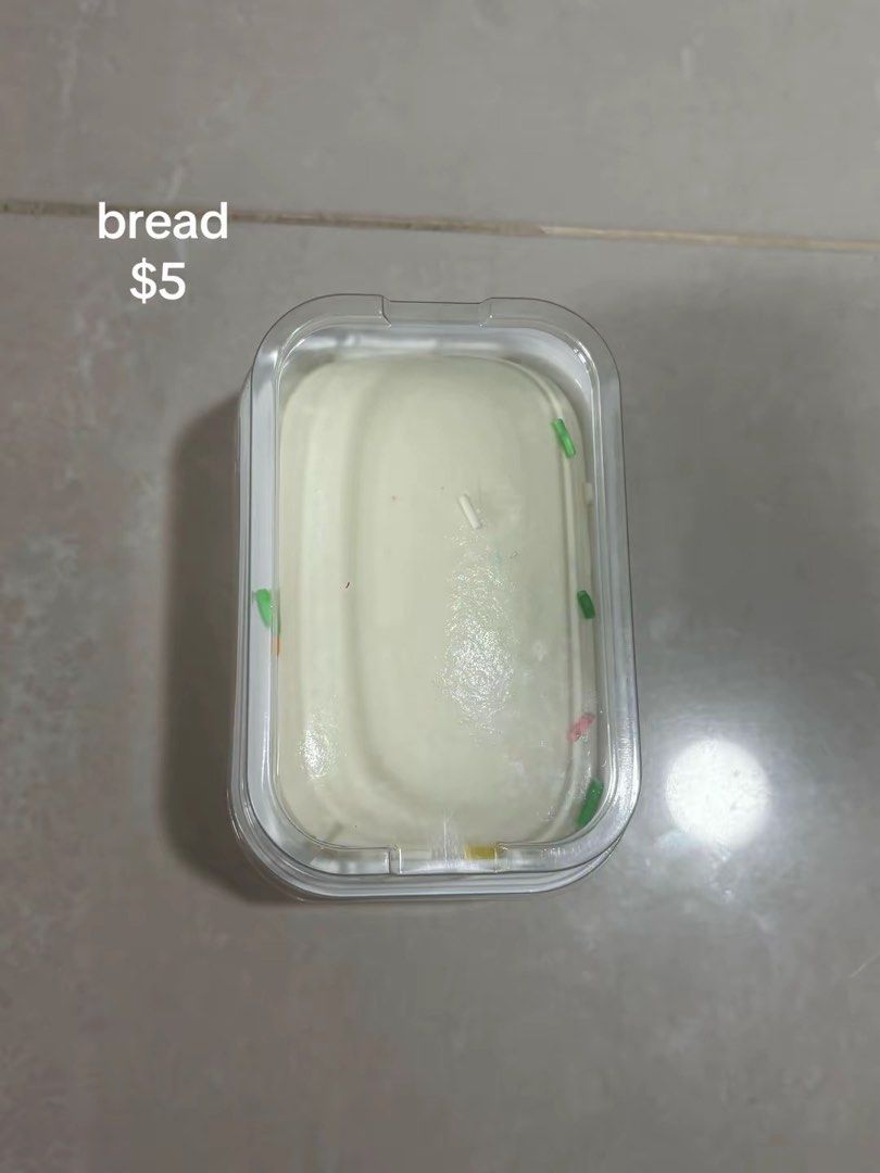 Bread squishy (Category: Designer & Blind Box Toys) located in Singapore. Submitted by malawithnoodles (Listing ID 1461033421, Image 1). Description: - Adorable candle shaped like a loaf of bread - Features embedded colorful sprinkles - Ideal for home decoration or as a unique gift - Approximate dimensions: [Insert dimensions if known] - Price is firm.