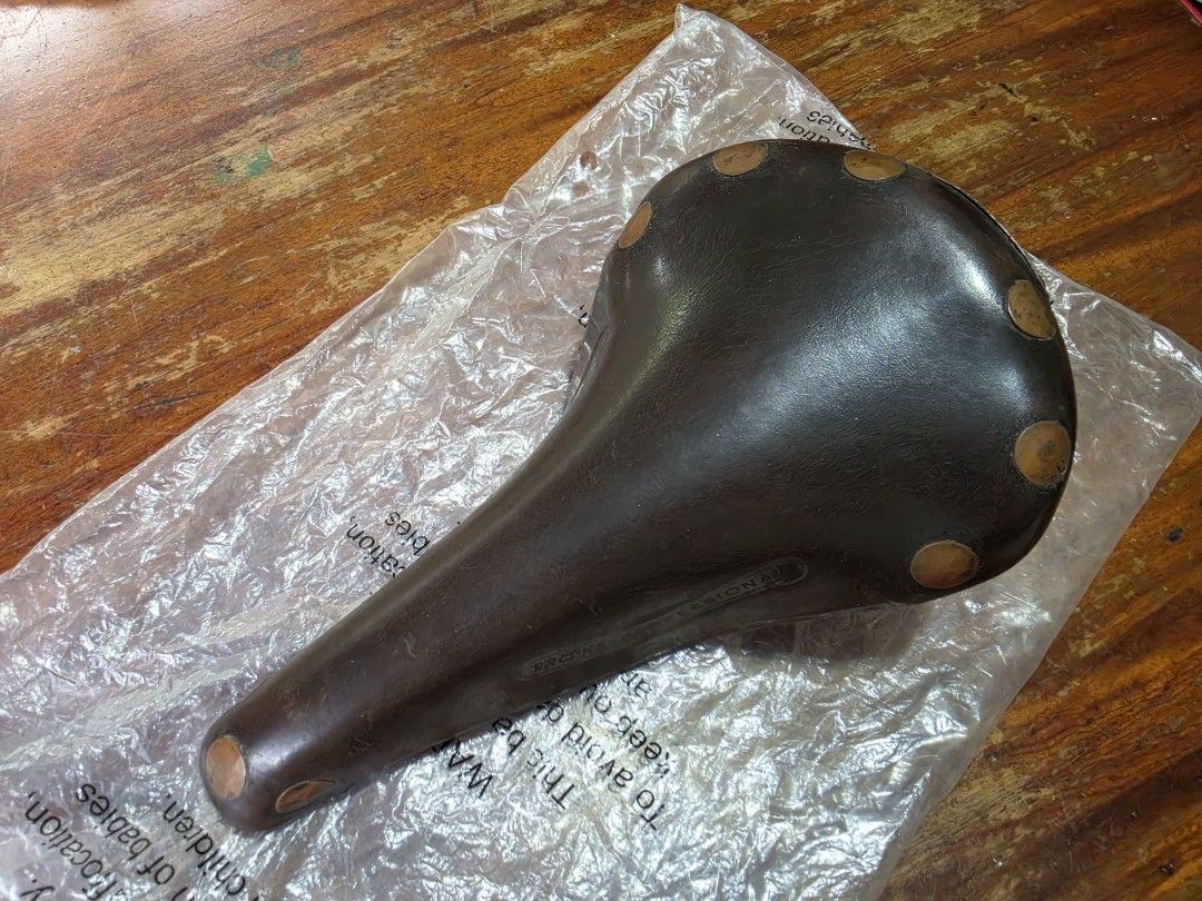 Brooks Professional Leather Bicycle Saddle (Category: Bicycles) located in Manila. Submitted by rogerpua168 (Listing ID 1460936973, Image 1). Description: - Classic Brooks Professional Copper leather saddle - Dark brown color - Iconic Brooks name embossed on the side - Chrome rails - Ideal for vintage bicycle builds or comfortable daily riding - Ready for its next adventure *price is negotiable *09328589495 .