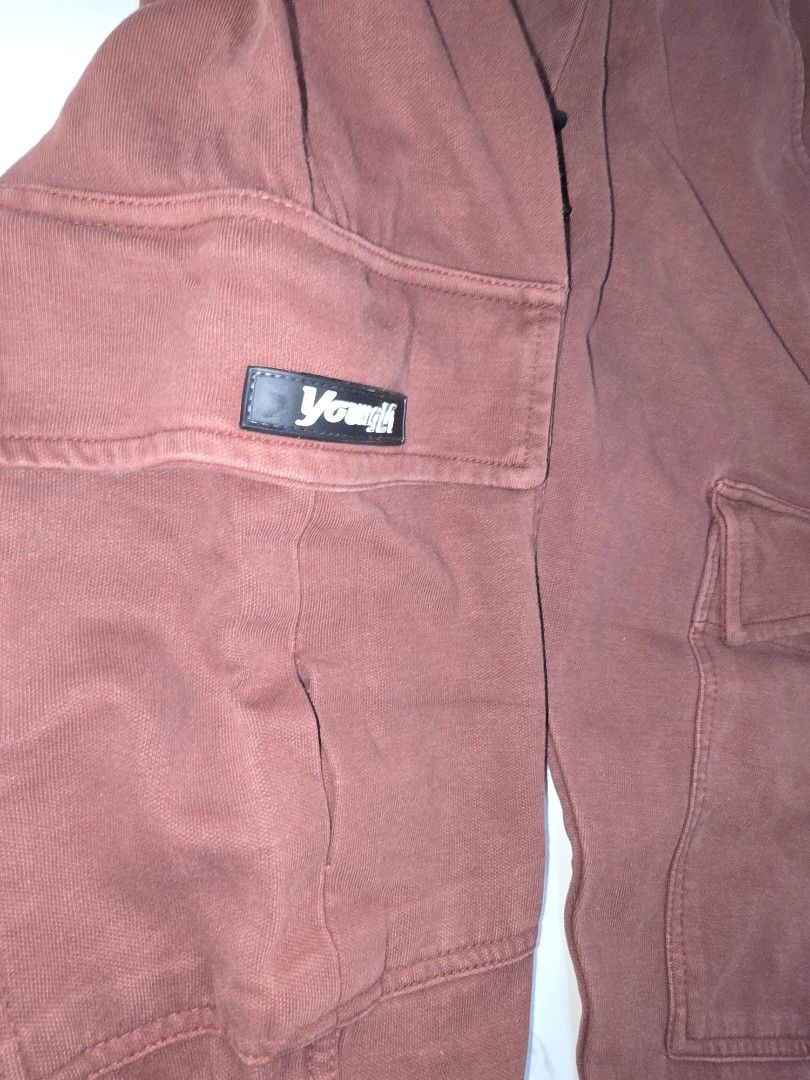 Brown Cargo Jogger Pants with Zip Pocket (Category: Joggers) located in La Trinidad. Submitted by odin21 (Listing ID 1460953511, Image 3). Description: - Stylish brown cargo jogger pants - Comfortable elastic waistband with adjustable drawstring - Convenient side pockets - Functional cargo pockets on both legs, one with a 'Future LA' tag - Secure zip pocket on the left thigh - Ribbed cuffs for a modern, tapered look small on tag.