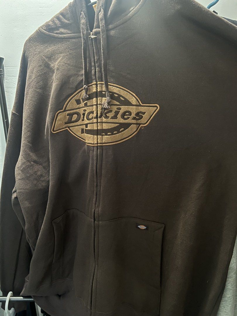 Brown Dickies Zip-Up Hoodie (Category: Hoodies) located in Manila. Submitted by flynnt2 (Listing ID 1461094229, Image 1). Description: Dickies fullzip SIZE L no issue GOOD AS NEW - Classic brown Dickies zip-up hoodie - Features iconic Dickies logo on the chest - Front pocket for convenience - Adjustable drawstrings for the hood - Ideal for casual wear and easy layering.