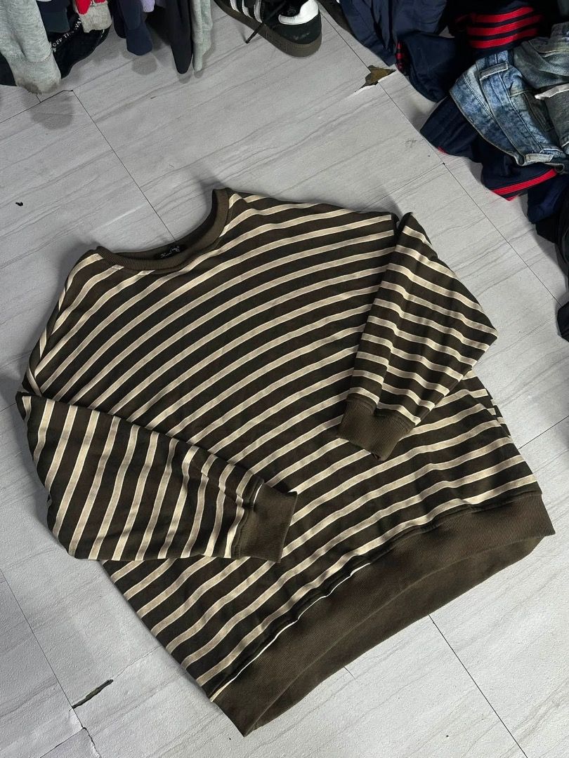 brown striped sweater (Category: Hoodies) located in Manila. Submitted by nb_thriftshop (Listing ID 1461073189, Image 1). Description: stripe long sleeve medium to large 27 length 26 width no issue.