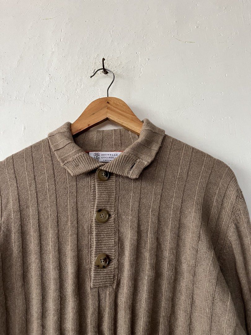 Brunello Cucinelli Cashmere Ribbed Polo Sweater (Category: Luxury Apparel) located in Las Pinas. Submitted by pawthrift (Listing ID 1460981663, Image 3). Description: - Brand: Brunello Cucinelli - Material: 100% Cashmere - Color: Taupe -Size Large to Xl 21.5 x 29 - Style: Ribbed Polo Sweater - Features: Button-up placket, Spread collar - Perfect for layering or wearing solo - Timeless wardrobe staple.
