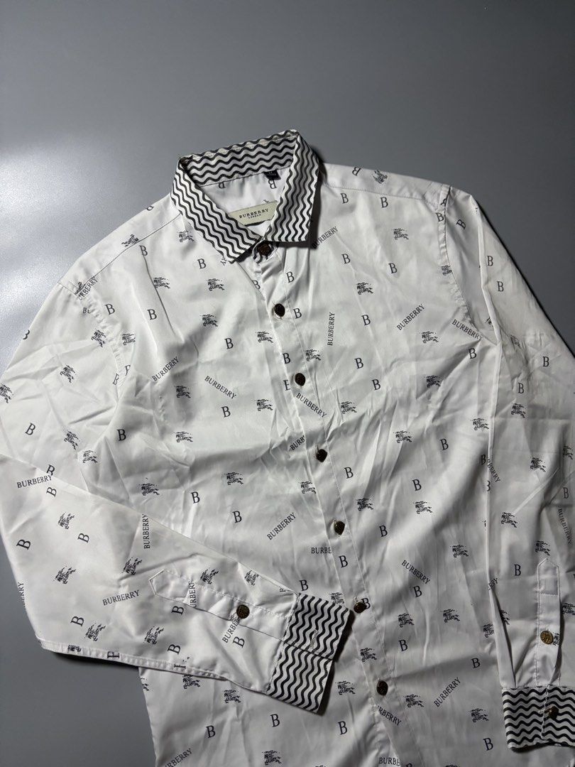 Burberry all over print button down (Category: Formal Shirts) located in Manila. Submitted by austinace04 (Listing ID 1460940708, Image 2). Description: - Excellent Condition - Size M On Tag - 19 x 27 - Issue None - 9.5x10 Color rate .