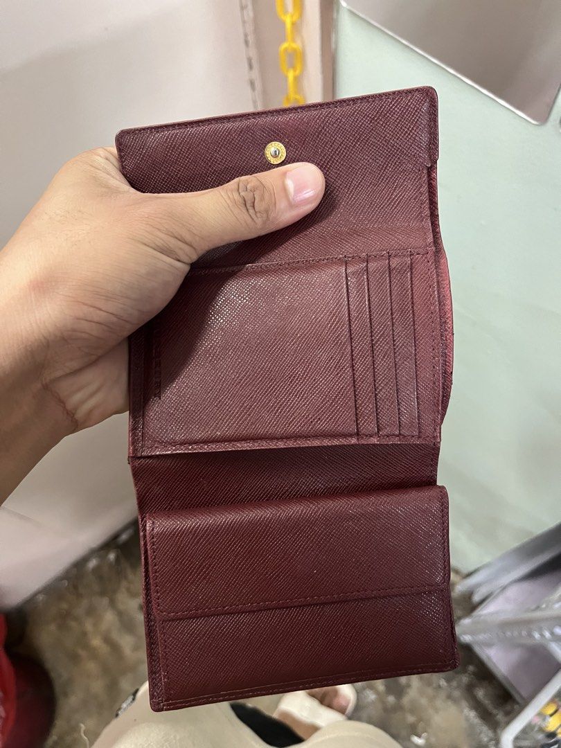 BURBERRY Bi-Fold Wallet Purse Nova (Category: Luxury Bags & Wallets) located in Urdaneta. Submitted by supremo_fi (Listing ID 1460974756, Image 3). Description: - Authentic Burberry Nova - Burgundy leather trim and interior - Multiple card slots - Coin compartment - Secure snap closure - With slight flaws.