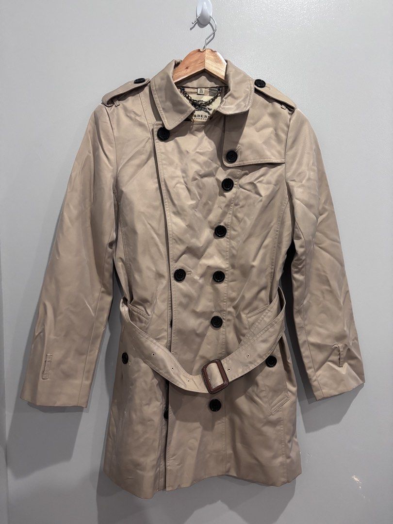 Burberry Trench Coat (Category: Luxury Apparel) located in Dumaguete. Submitted by dgte.grails (Listing ID 1461031313, Image 1). Description: Burberry Trench Coat Size 28-32 length 33 Good as new! 1800+sf pm.