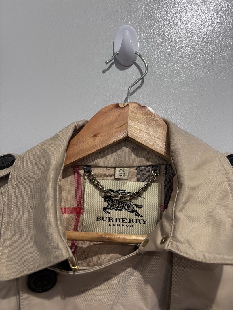Burberry Trench Coat (Category: Luxury Apparel) located in Dumaguete. Submitted by dgte.grails (Listing ID 1461031313, Image 2). Description: Burberry Trench Coat Size 28-32 length 33 Good as new! 1800+sf pm.