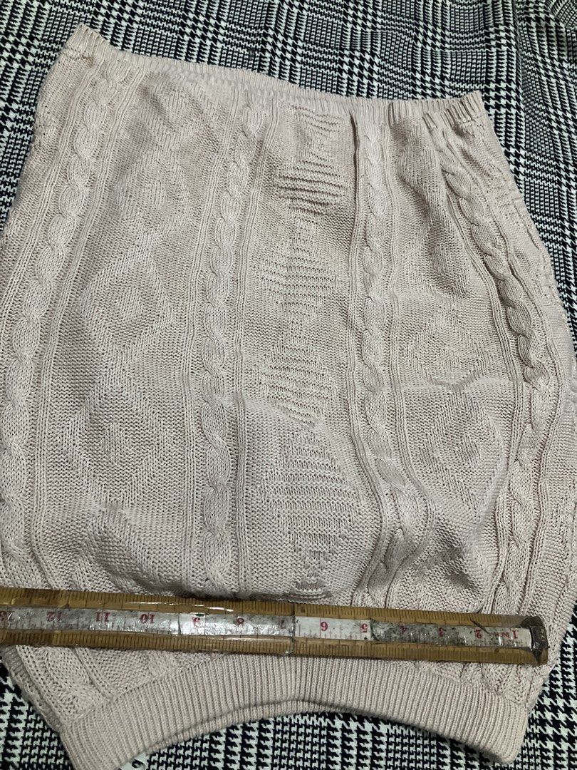 Cable-knit mini skirt (Category: Skirts) located in Angeles City. Submitted by jnwsurplus (Listing ID 1460997552, Image 2). Description: Plss see pictures for the size This is a beige cable-knit mini skirt featuring a classic vertical braided pattern and a ribbed hem. Add sf.