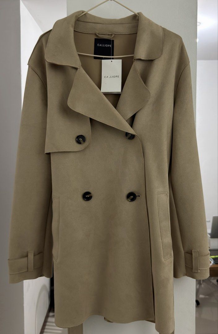 CALLIOPE Beige Suede Trench Coat (Category: Coats, Jackets and Outerwear) located in Las Pinas. Submitted by cassie1919 (Listing ID 1461069619, Image 2). Description: - CALLIOPE Beige Suede Trench Coat - Brand new (RFS: Wrong size) - Size is large but can fit S-M frames - Original tag still attached - bought from mall (currently out of stock na sa malls and online so it’s really a steal huhu) - VERY GOOD QUALITY 🥹.