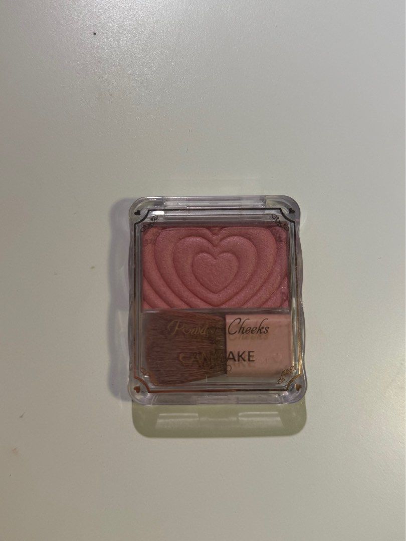 Canmake Powder Cheeks Blush (Category: Makeup) located in Pasig City. Submitted by zenowl.61105a (Listing ID 1460975101, Image 1). Description: - Canmake Powder Cheeks blush - Lovely pink shade - Features a cute heart imprint - Comes with a small brush - Adds a natural flush to cheeks - Easy to carry for touch-ups -Swatched once on hand to show color - Perfect for: Everyday wear - Reason for selling: Not my shade -Used but twice and sanitized it 