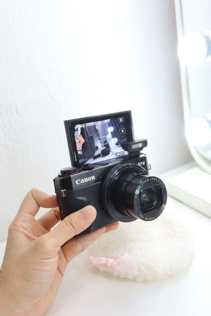 Canon G7X Mark II Digital Camera with Accessories (Category: Cameras) located in Davao. Submitted by Closetbydazzle (Listing ID 1461061339, Image 1). Description: - Canon G7X Camera - Flip-up screen, ideal for selfies and vlogging - 4.2x optical zoom lens - Includes: Silicone case, battery, charger, SD card - All accessories shown are included - Can do VC 📍Davao City 📍Meet up sm ecoland Davao City - Ready to capture your moments!.