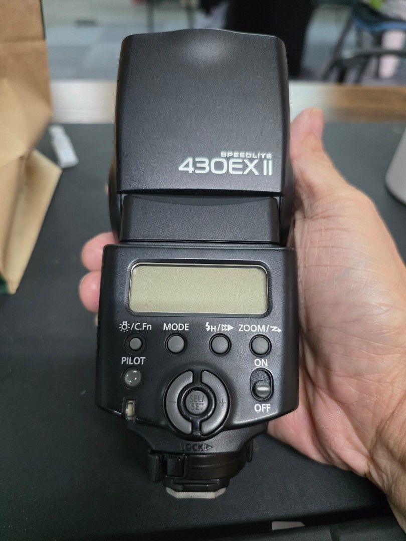 Canon Speedlite 430EX II External Flash (Category: Flashes) located in Pasig City. Submitted by trisporthunter (Listing ID 1460997102, Image 2). Description: - Canon Speedlite 430EX II external flash - Includes Canon protective pouch - Excellent working condition - Ideal for photography needs.