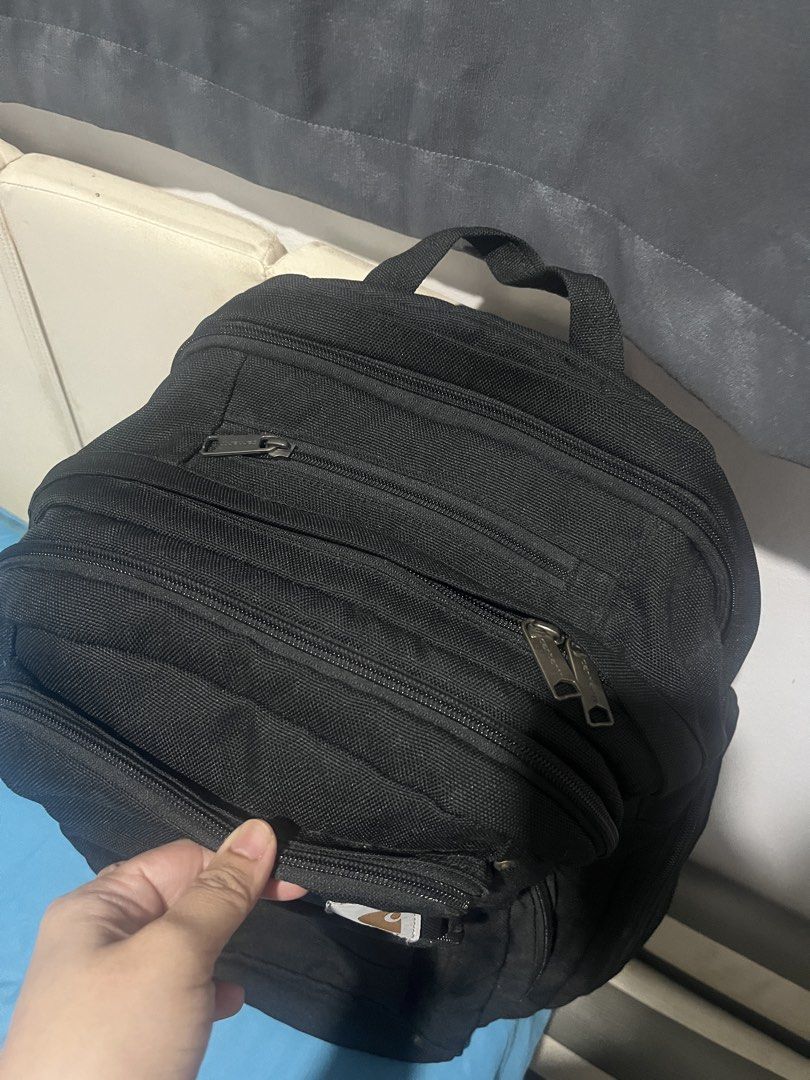 Carhartt Black Backpack (Category: Backpacks) located in Makati City. Submitted by asdjpa (Listing ID 1461015222, Image 3). Description: - 100% authentic - Classic black Carhartt backpack - Durable material built to last - 5 Multiple pockets for organized storage - 3 main storage - Sturdy zippers featuring the Carhartt logo - Ample interior space - Ideal for school, work, or everyday adventures.