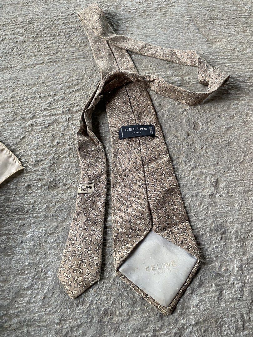 Celine Paris Pure Silk Tie (Category: Ties) located in Zamboanga. Submitted by trippsnthrifts (Listing ID 1461087637, Image 1). Description: - Authentic Celine Paris tie - Crafted from 100% pure silk - Features a subtle floral pattern in beige and brown - Proudly made in Spain - An elegant accessory to elevate any formal outfit.