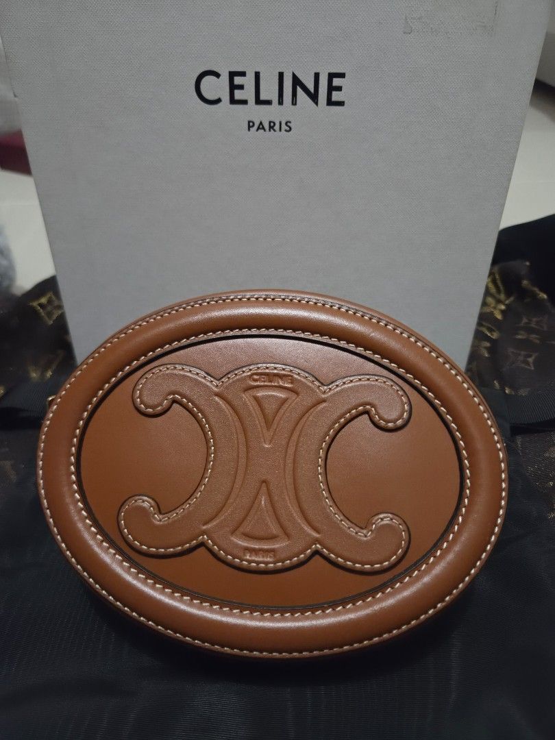 Celine Triomphe Round Bag Tan Leather (Category: Luxury Bags & Wallets) located in Pasig City. Submitted by sashasarisarishoppe (Listing ID 1460978757, Image 1). Description: - Authentic Celine Round Bag - Color: Tan Leather - Features iconic Triomphe logo embossing - Secure zipper closure - Includes a long strap for versatile wear - Original box included - Ideal for carrying your daily essentials -With minimal signs of usage.