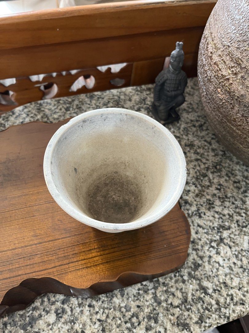 Ceramic Pot Planter (Category: Pots & Planters) located in Taguig. Submitted by minmin_parker (Listing ID 1461000680, Image 3). Description: - Handmade ceramic pot - Textured, rustic finish - White and grey tones - Subtle horizontal ridges - Ideal for small plants or as a decorative piece - Shows minor signs of use inside (consistent with age/material) - Unique home decor item.