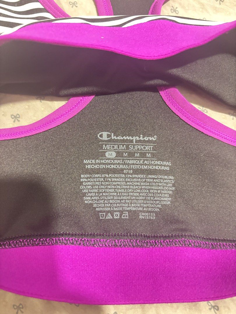 Champion Support Sports Bra Striped (Category: Activewear) located in Lapu Lapu. Submitted by affordmo (Listing ID 1461003192, Image 3). Description: - Champion Sports Bra - Size: Medium but fits small only - Color: Black and white stripes with bright purple band and trim - Support Level: Medium - Made in Honduras - Ideal for workouts or everyday wear.